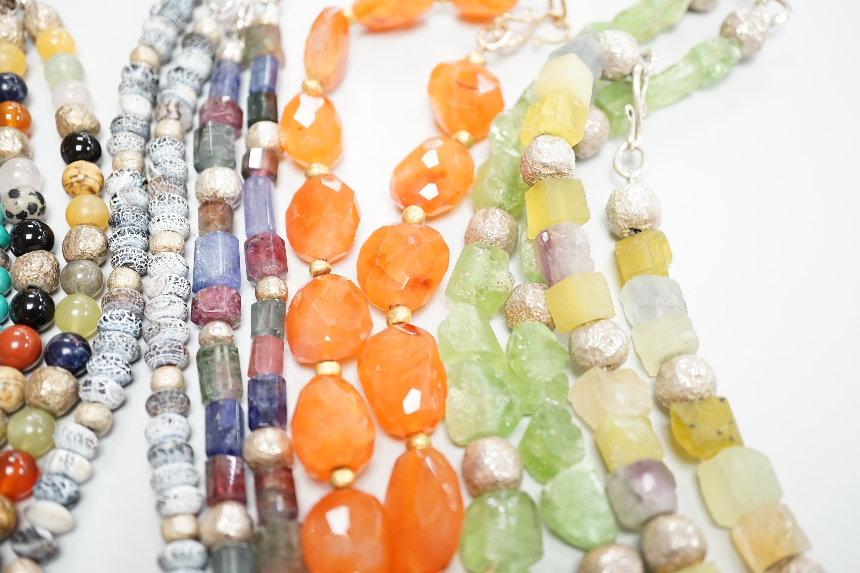 Five assorted Pruden & Smith silver and hardstone necklaces, largest 42cm and three other similar unsigned necklaces.